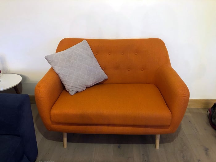 Orange retro sofa Revive