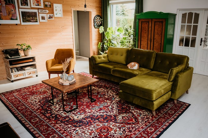 Zielony narożnik Magnus i fotel Beca