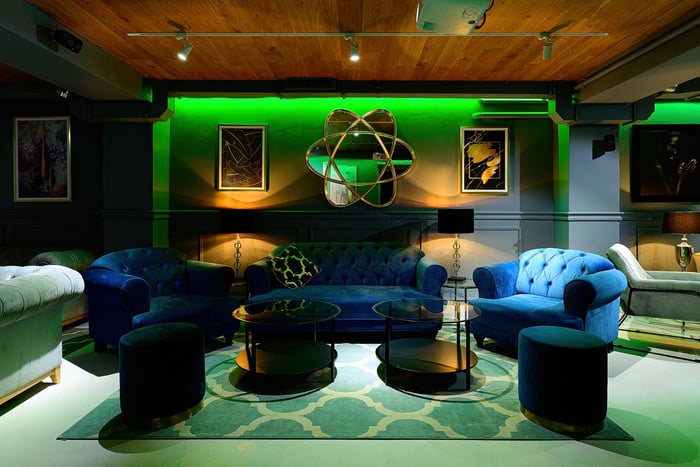 Dark blue sofa and Harto armchairs